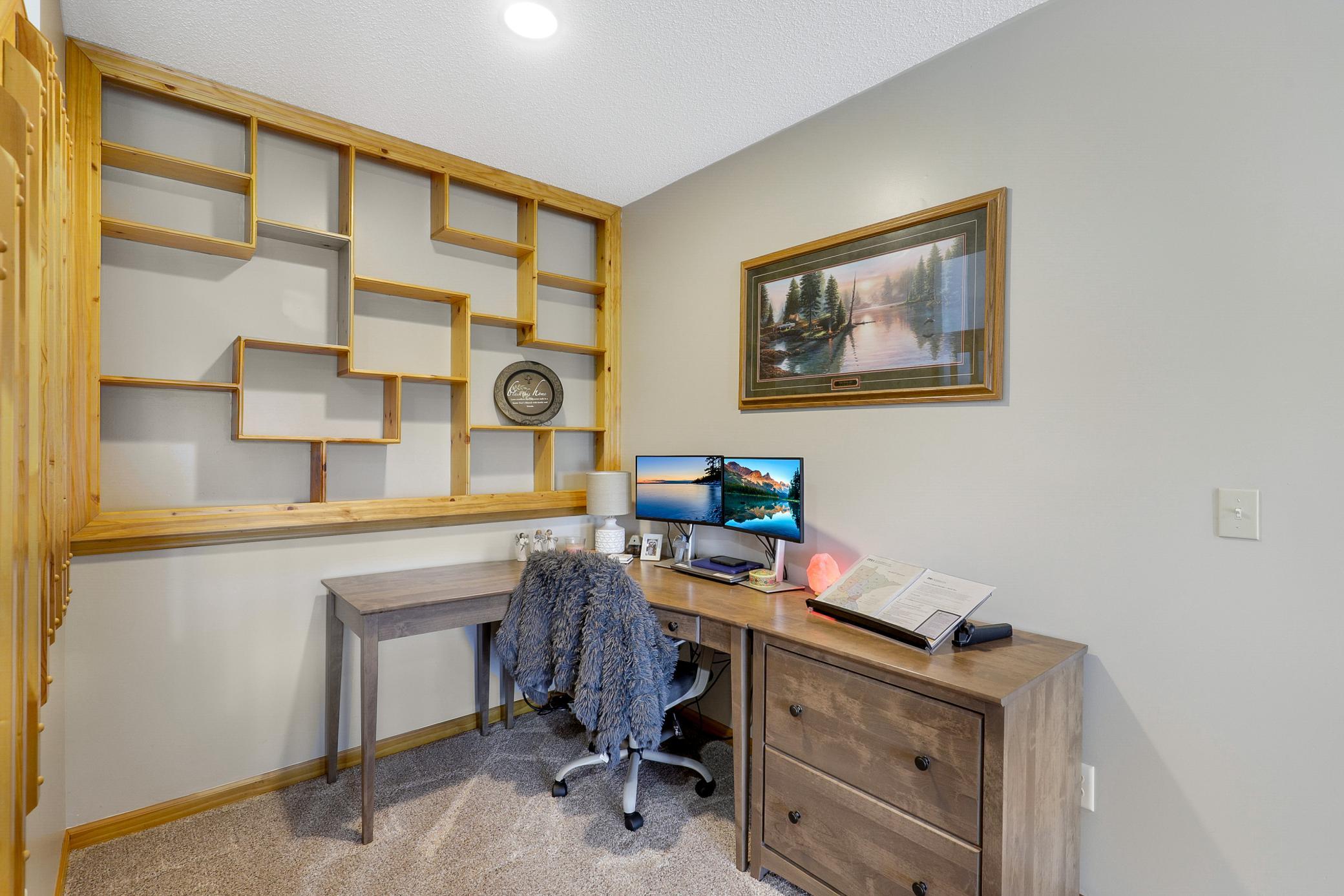 The walkout lower level extends the living space with two additional bedrooms, a large family room with a gas fireplace and an office nook, and a full laundry room that also functions as a mudroom.