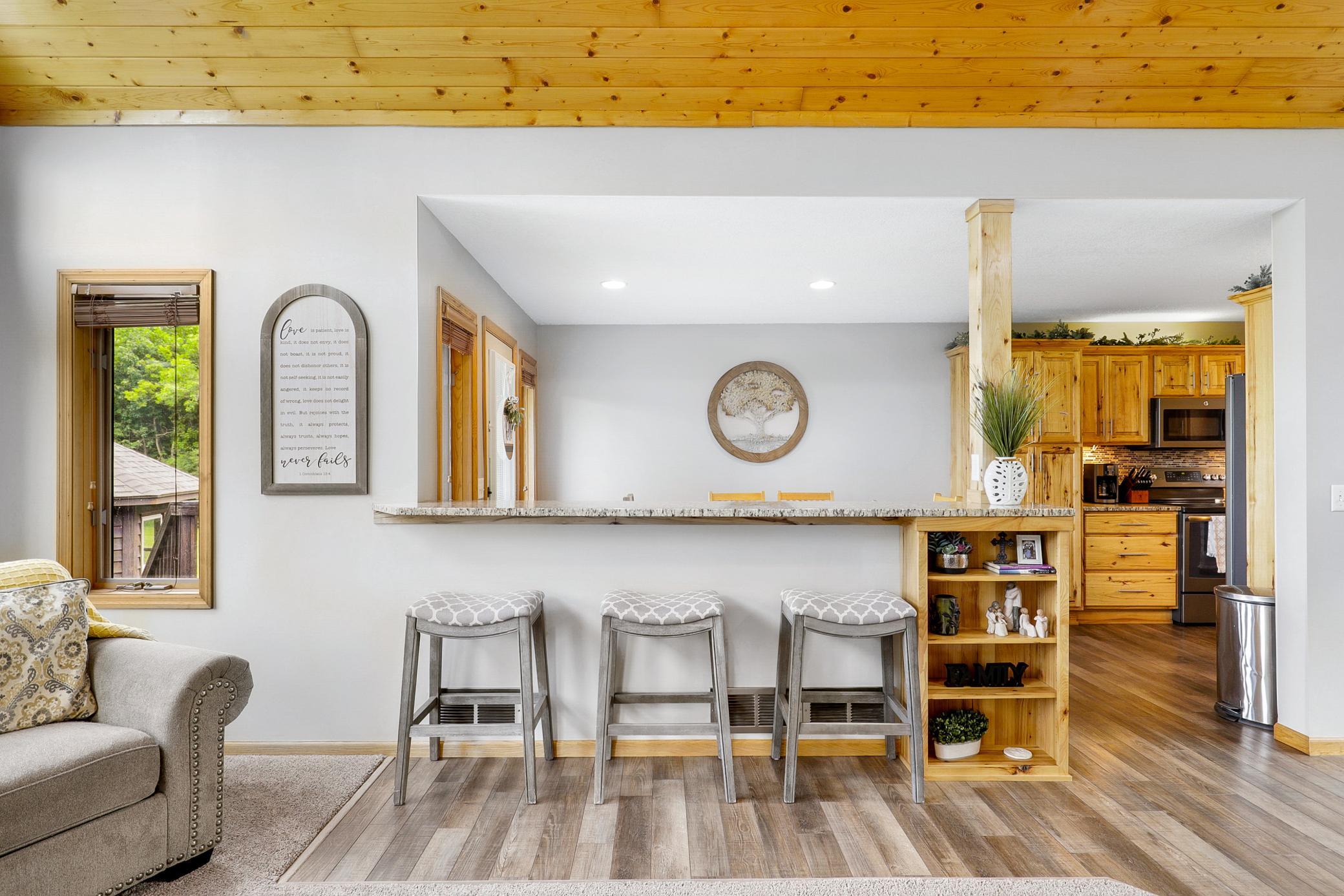 A 2017 renovation opened the kitchen, dining, and living areas, which included refaced cabinetry, new LVP flooring, granite countertops, new GE appliances, and a fresh knockdown ceiling.