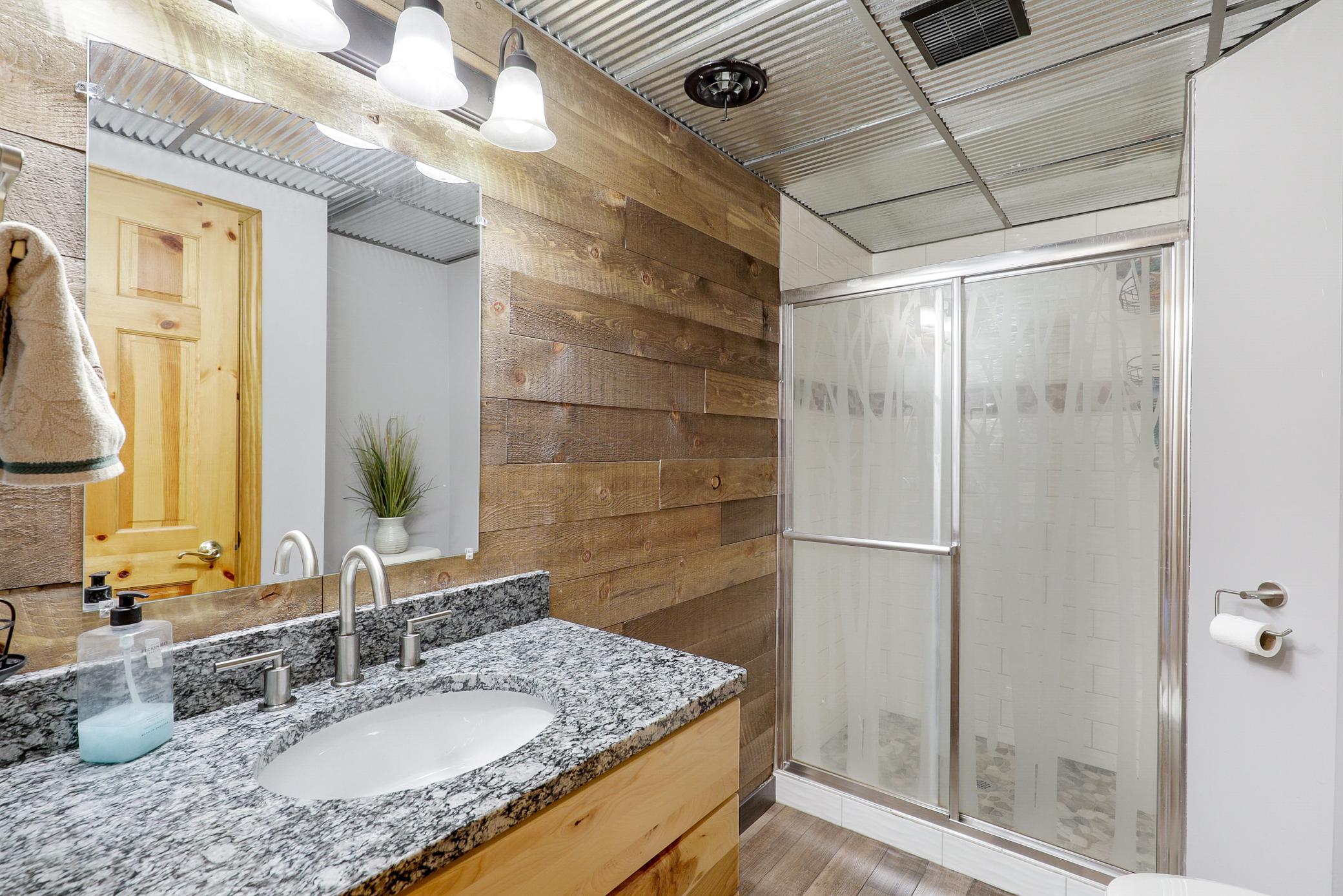 A 3/4 bathroom serves the lower-level bedrooms and common space.