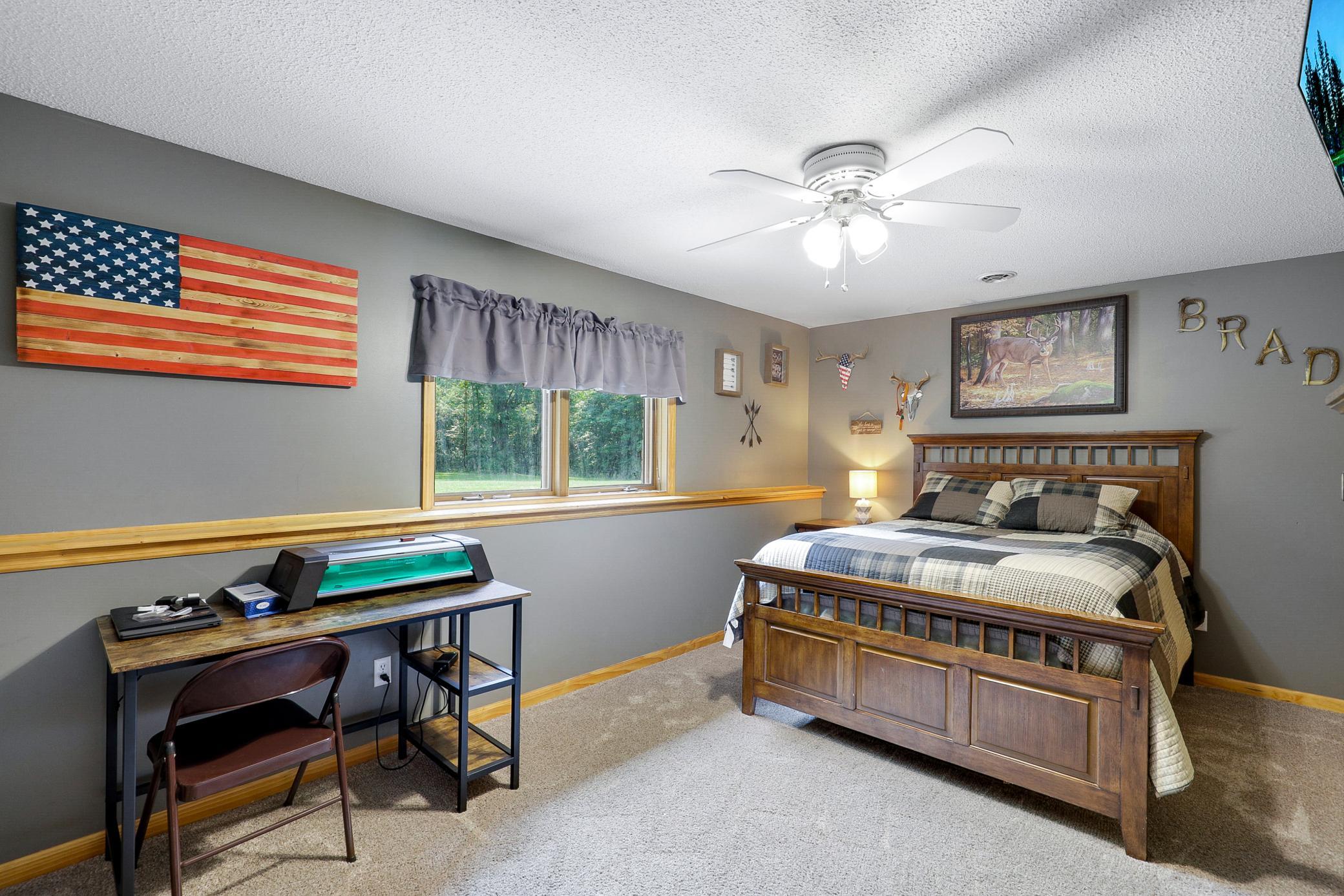 The walkout lower level extends the living space with two additional bedrooms, a large family room with a gas fireplace and an office nook, and a full laundry room that also functions as a mudroom.