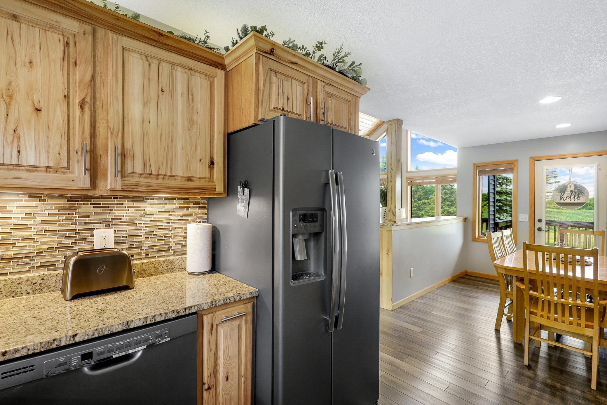A 2017 renovation opened the kitchen, dining, and living areas, which included refaced cabinetry, new LVP flooring, granite countertops, new GE appliances, and a fresh knockdown ceiling.