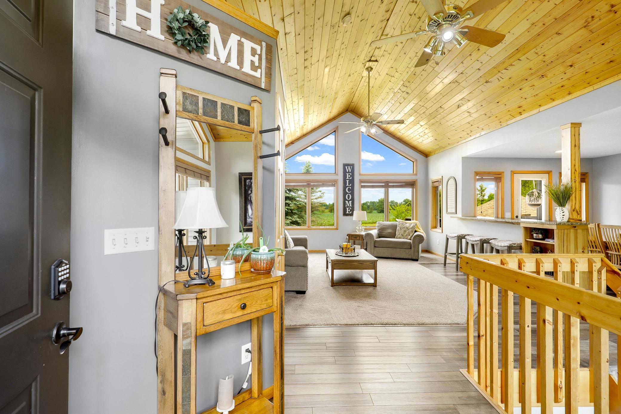 The main floor is bright open with vaulted ceilings, large windows and expansive nature views from every room.