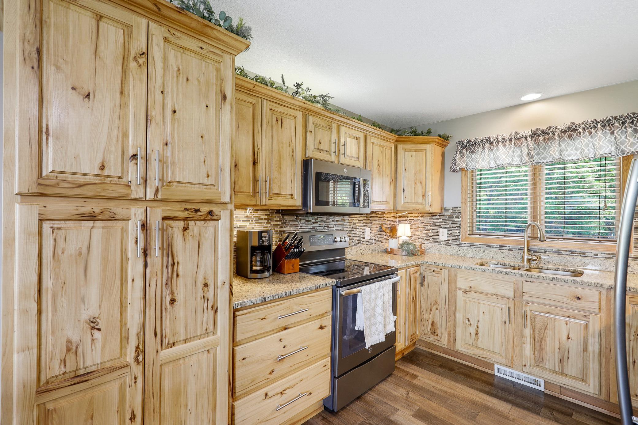 A 2017 renovation opened the kitchen, dining, and living areas, which included refaced cabinetry, new LVP flooring, granite countertops, new GE appliances, and a fresh knockdown ceiling.