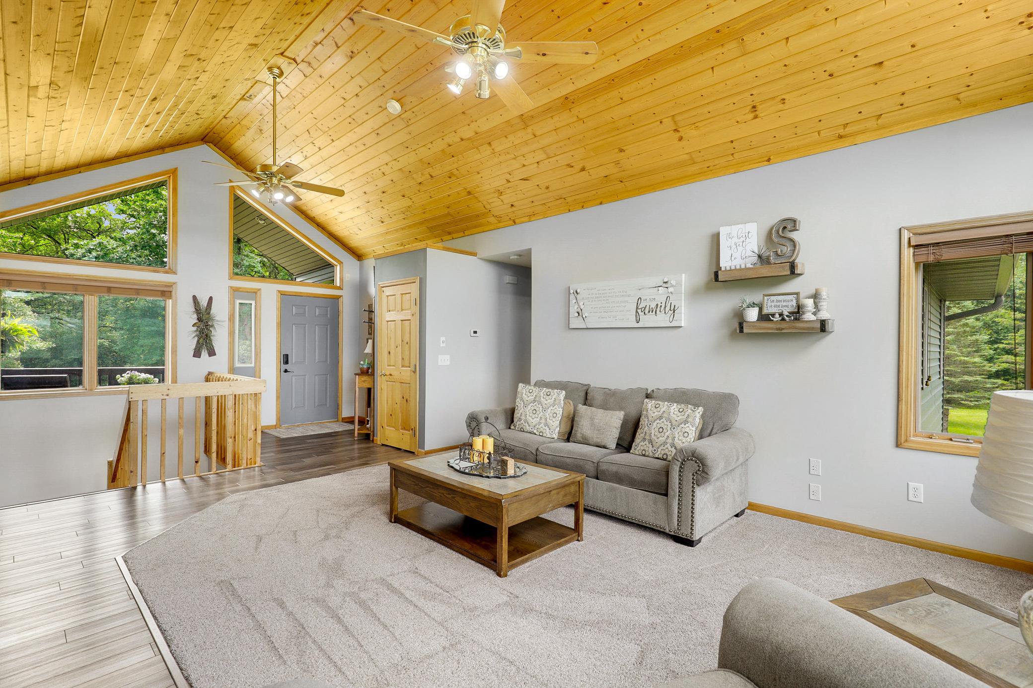 The main floor is bright open with vaulted ceilings, large windows and expansive nature views from every room.