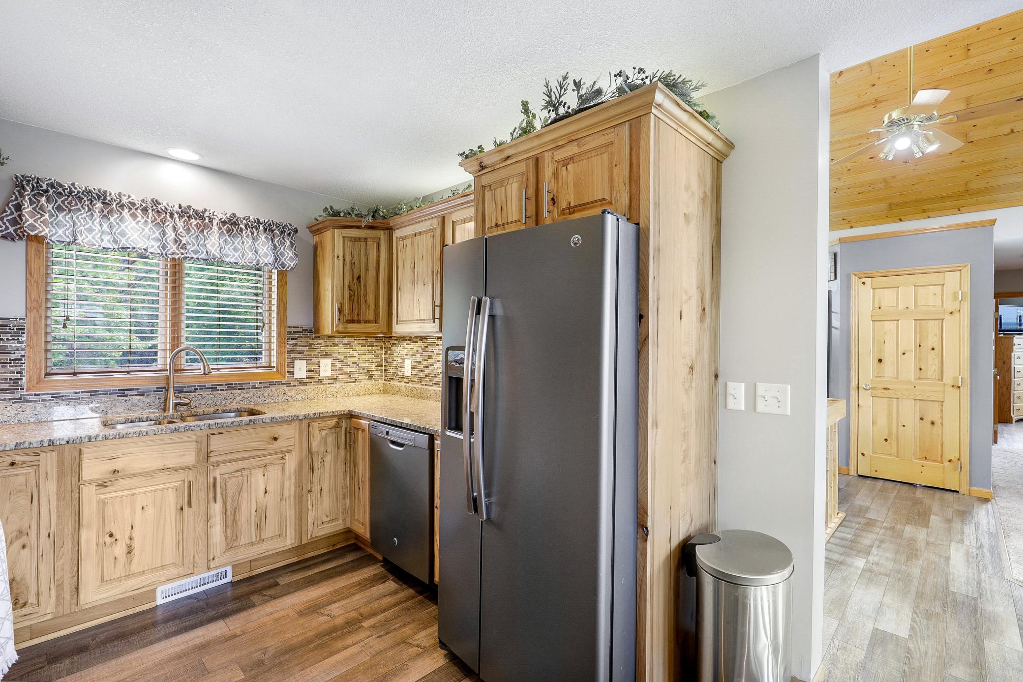 A 2017 renovation opened the kitchen, dining, and living areas, which included refaced cabinetry, new LVP flooring, granite countertops, new GE appliances, and a fresh knockdown ceiling.