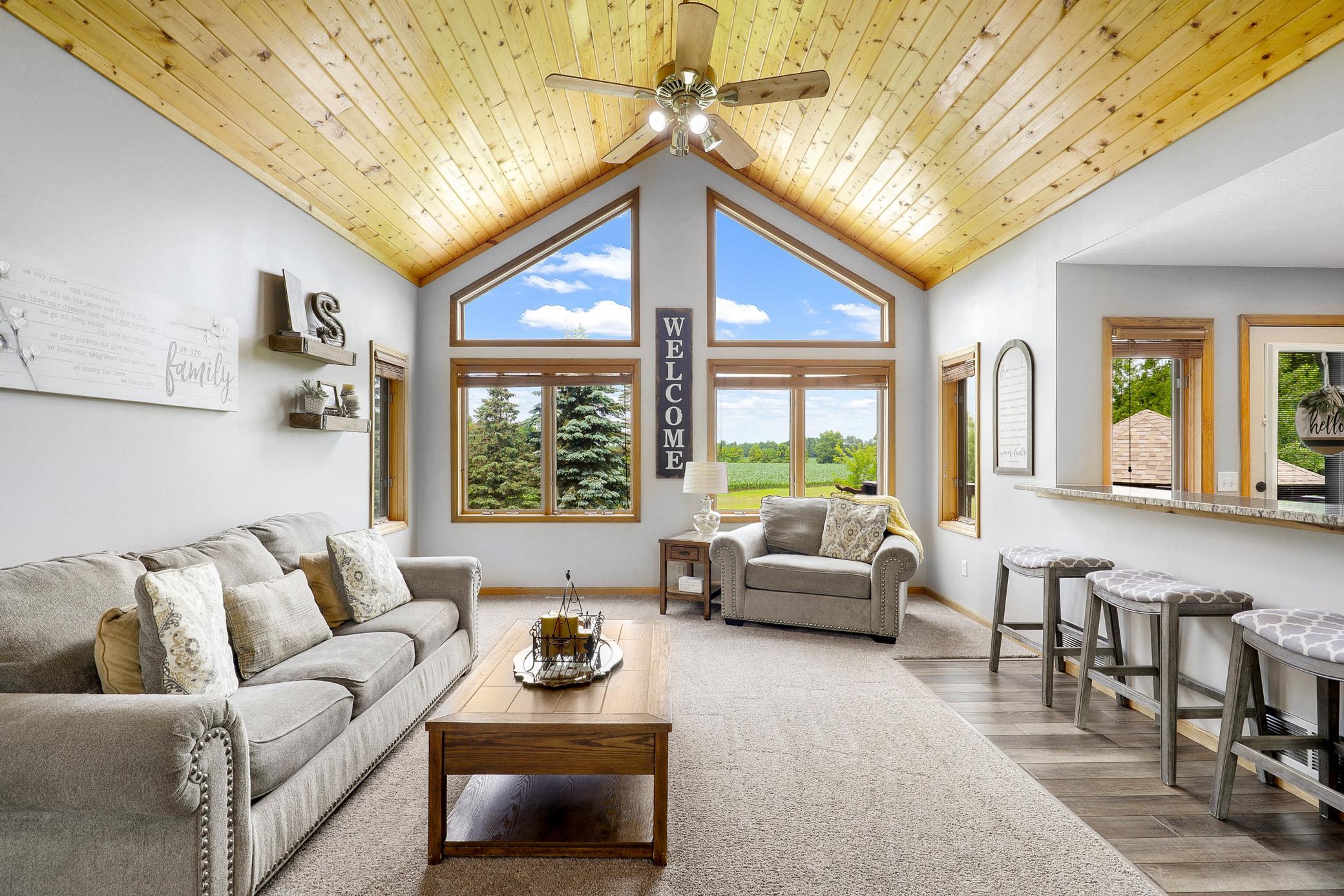 The main floor is bright open with vaulted ceilings, large windows and expansive nature views from every room.