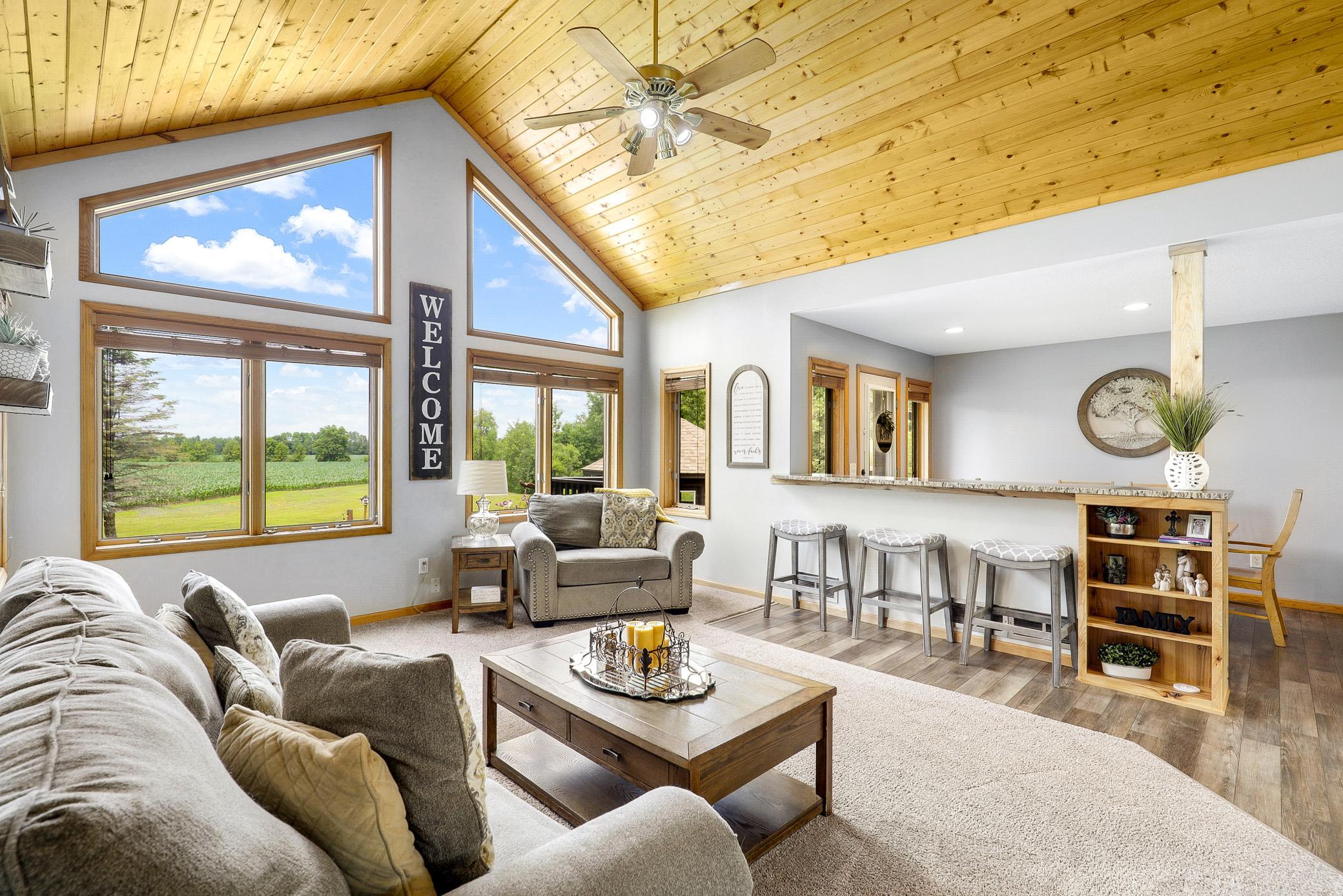 The main floor is bright open with vaulted ceilings, large windows and expansive nature views from every room.