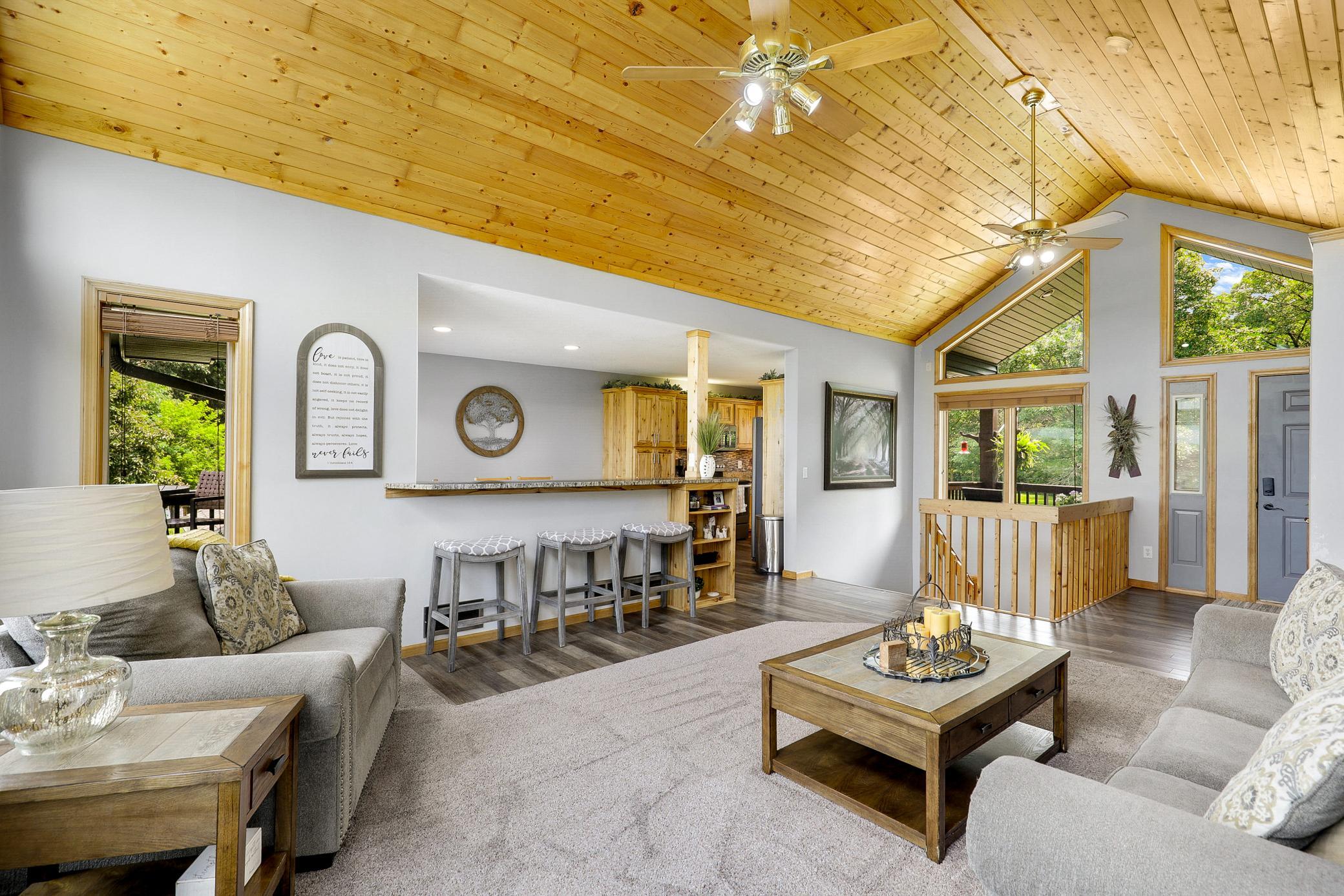 The main floor is bright open with vaulted ceilings, large windows and expansive nature views from every room.