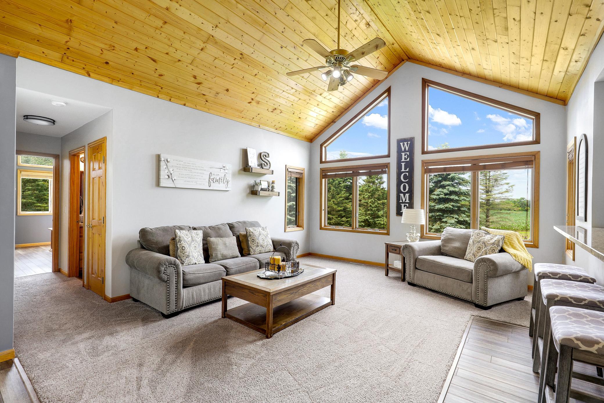 The main floor is bright open with vaulted ceilings, large windows and expansive nature views from every room.
