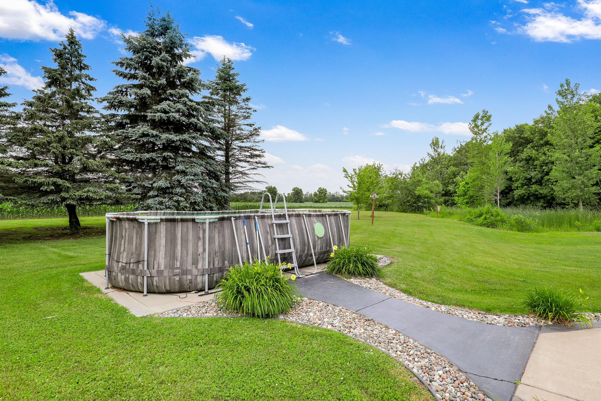 A new above ground pool, added in 2024, enhances the property’s outdoor enjoyment and rounds out a truly versatile and picturesque landscape.
