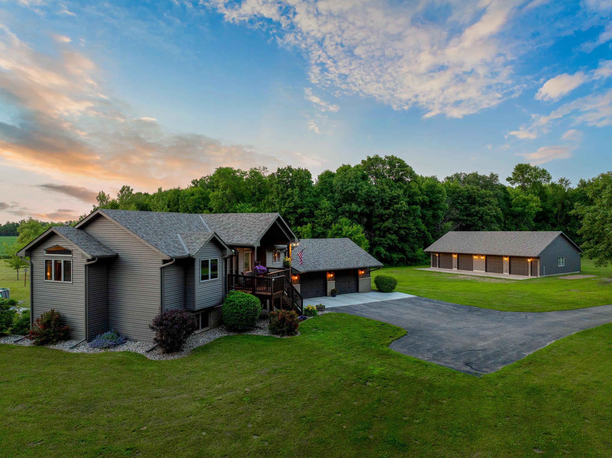 Expansive outdoor spaces, including a deck with a gazebo, a large patio, and a new pool, create an inviting setting for entertaining or unwinding, while the surrounding land provides room to roam and the unique ability to hunt on your own property.