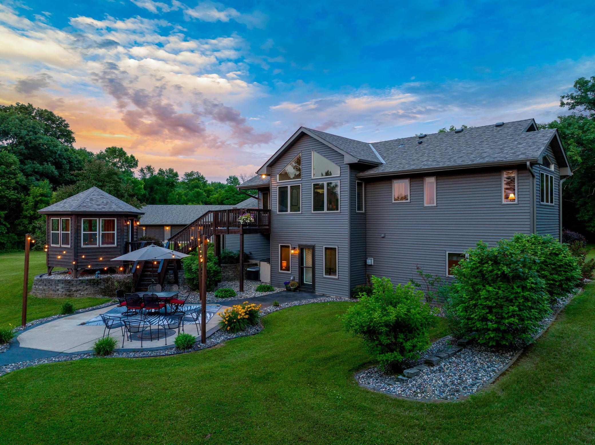 Expansive outdoor spaces, including a deck with a gazebo, a large patio, and a new pool, create an inviting setting for entertaining or unwinding, while the surrounding land provides room to roam and the unique ability to hunt on your own property.