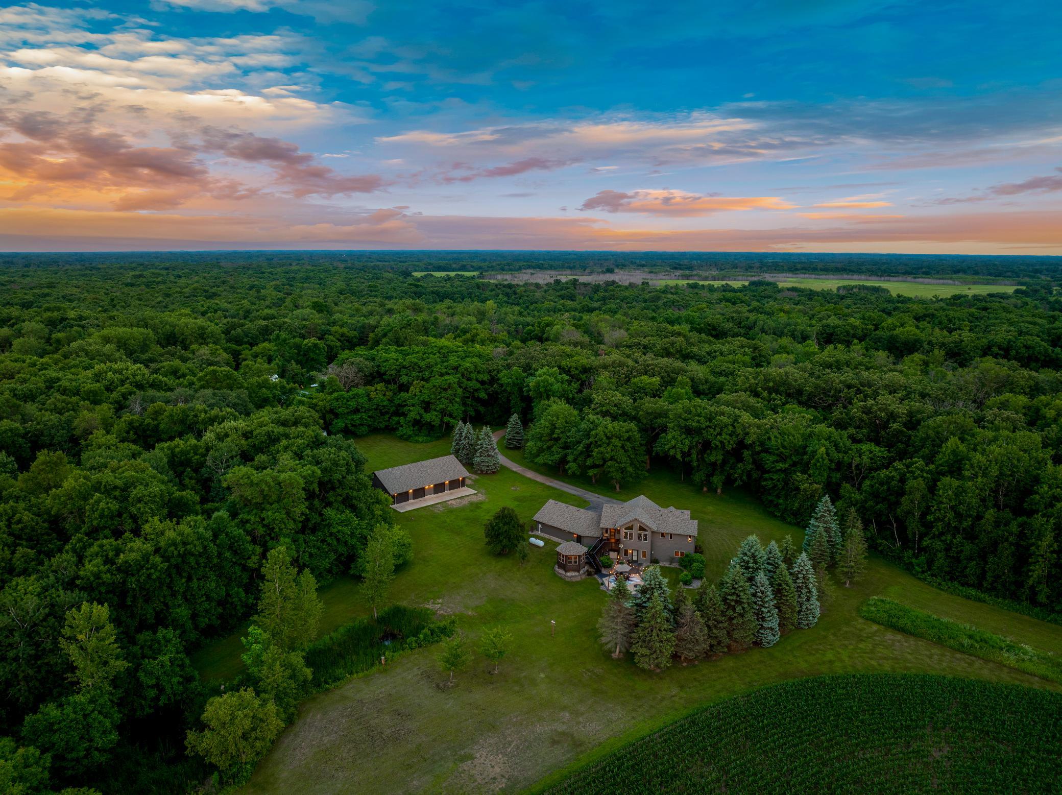 Expansive outdoor spaces, including a deck with a gazebo, a large patio, and a new pool, create an inviting setting for entertaining or unwinding, while the surrounding land provides room to roam and the unique ability to hunt on your own property.
