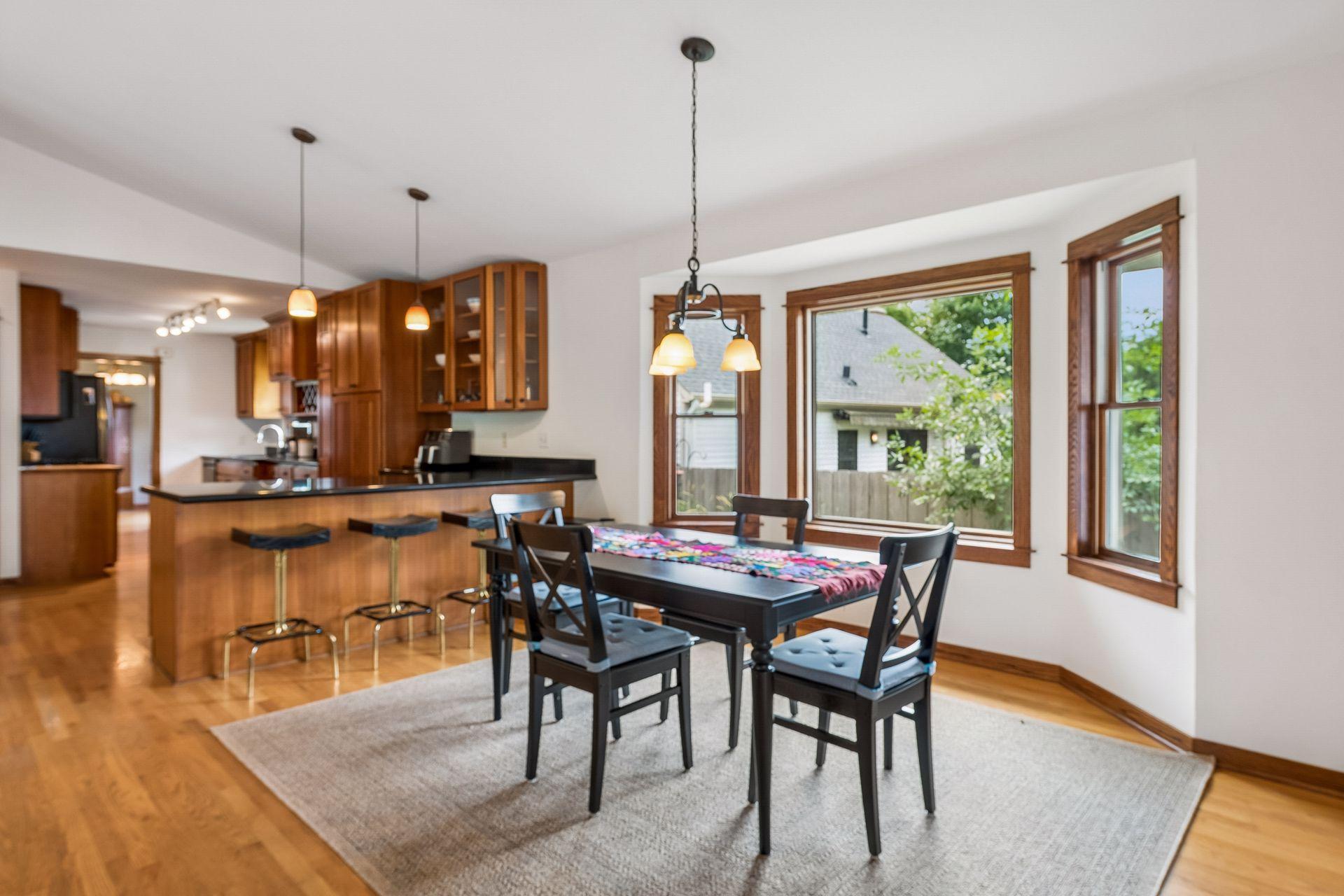 Big eat-in kitchen with bay window and hardwood floors