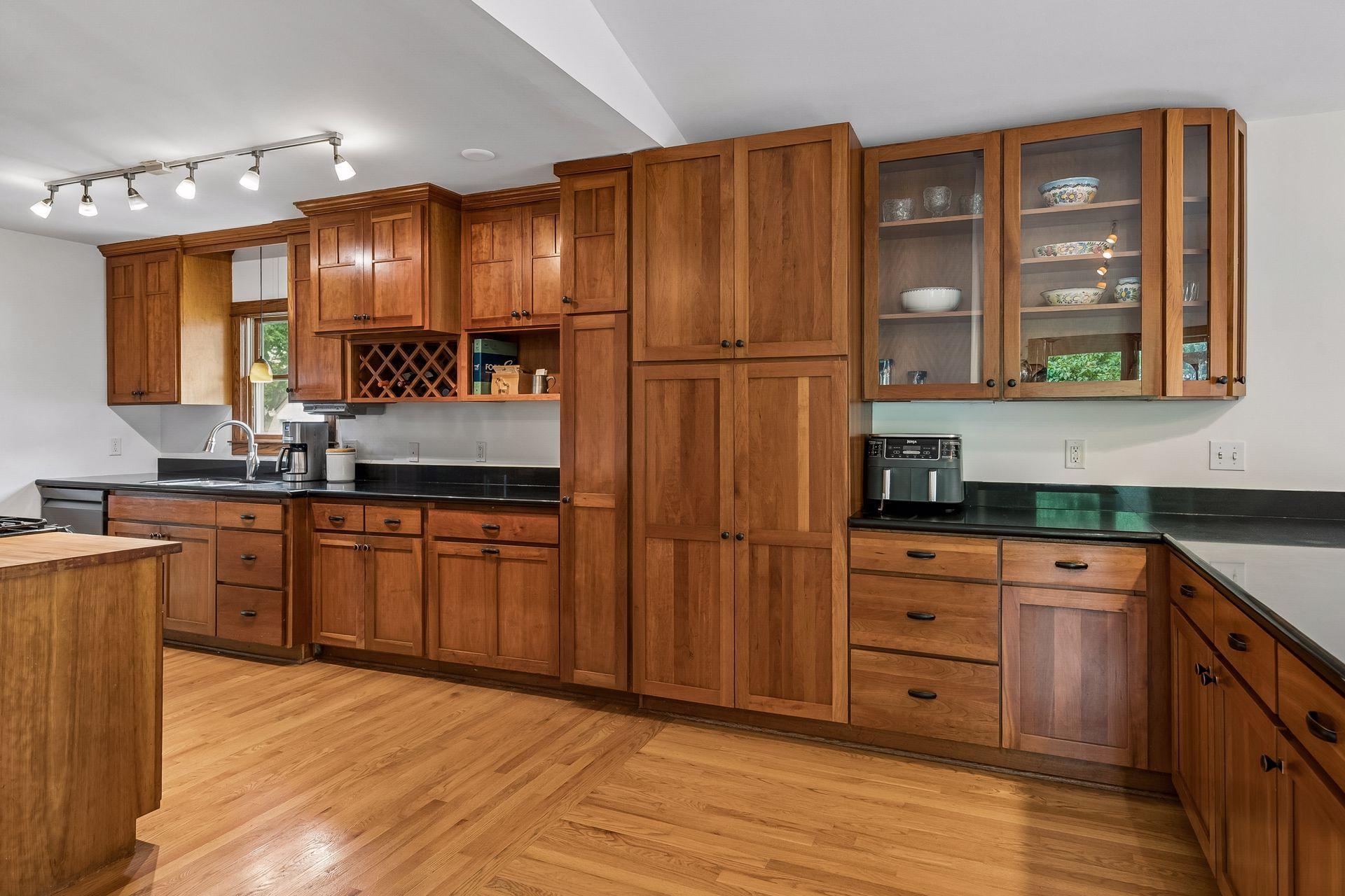 Cherry and granite kitchen with new range in 2024