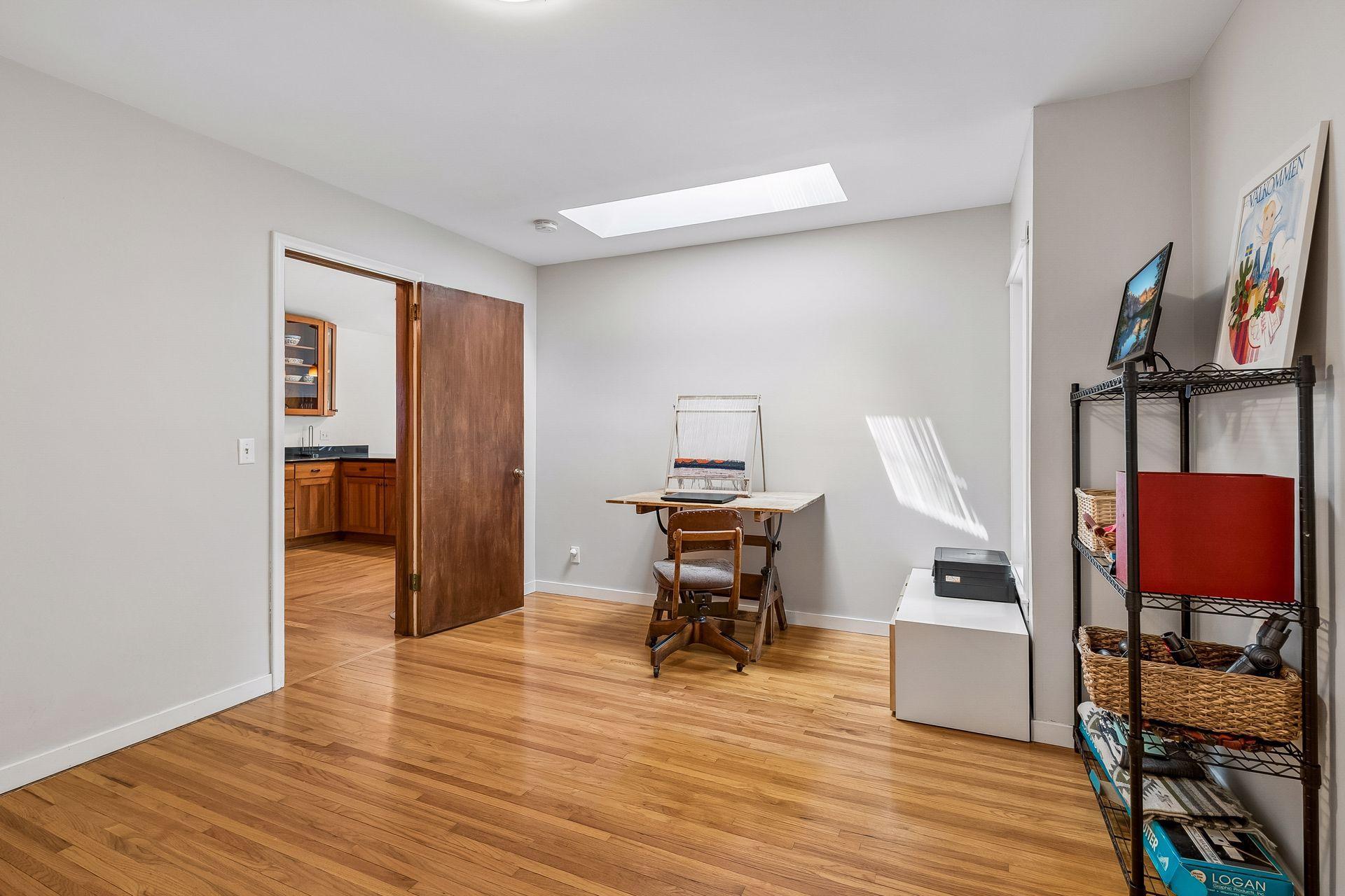 Bedroom #3 of 3 on main with skylights and hardwood floors...makes a great office.