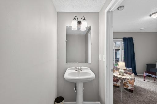 The main-level bedroom is also conveniently connected to a 1/2 bath.