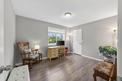 Second upper level bedroom with gleaming LVP flooring.