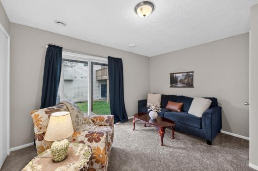 This flexible main-level bedroom offers direct patio access.