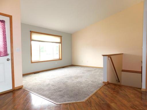 Main floor living room with large picture window.