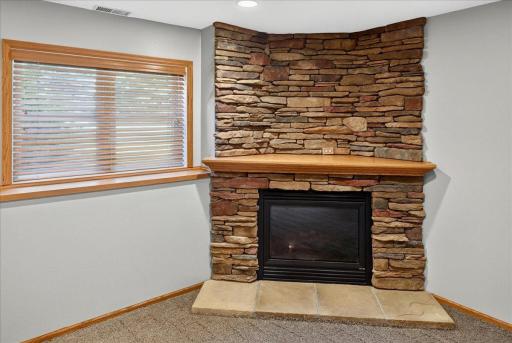 Lower Level Gas Fireplace with stone surround