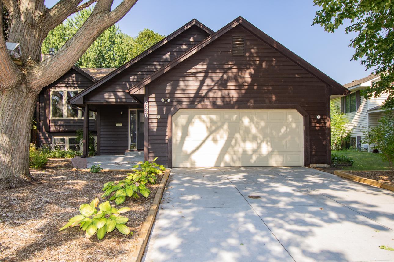 Two-car garage, concrete driveway and easy care front yard landscaping.