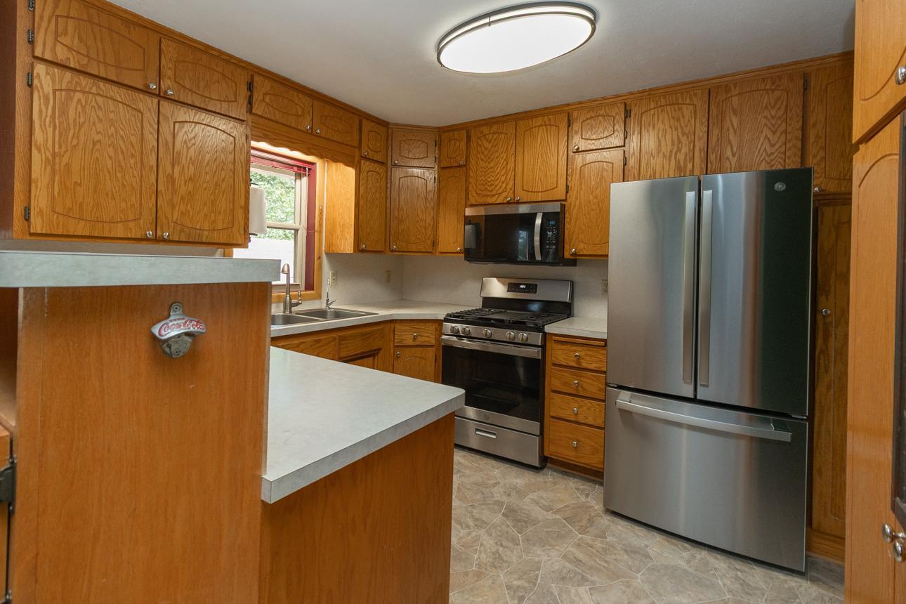 Classic functionality greets you in the cabinet-rich kitchen