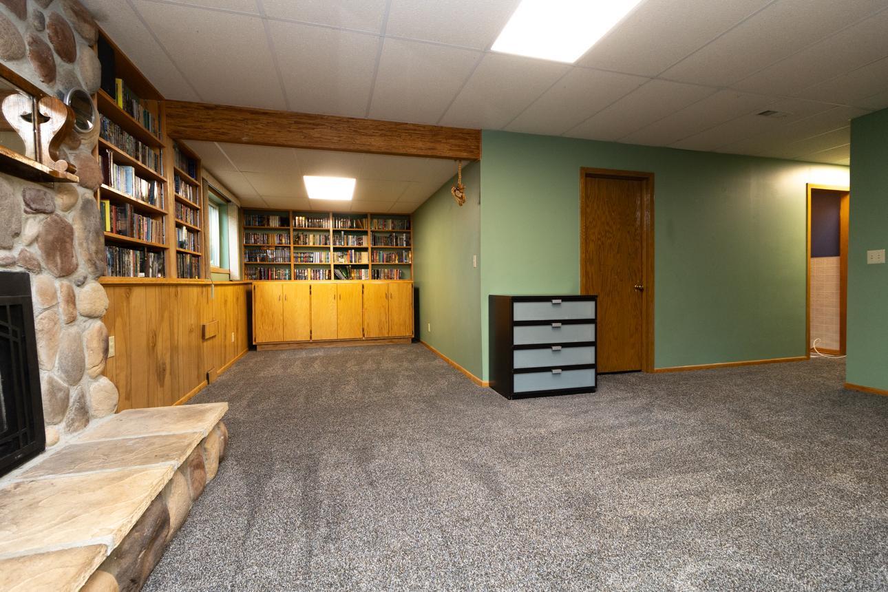 In the lower level, you'll find custom built-ins for your collection of movies, games, books or records. Laundry and mechanicals behind door.