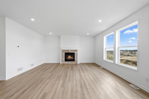 The Great Room features large windows for ample natural light and is the perfect place for gathering with friends and family.