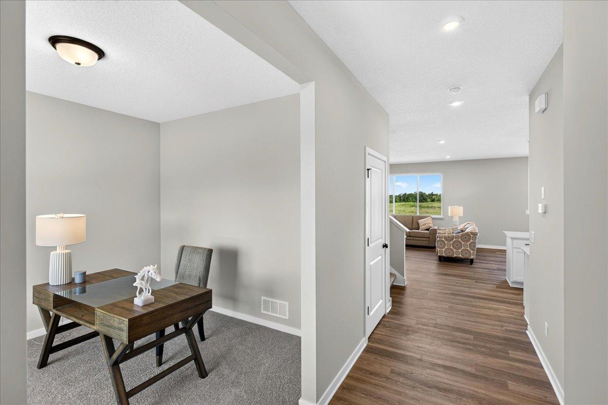 PHOTO OF A DIFFERENT HOME WITH SIMILAR PLAN & FINISHES.