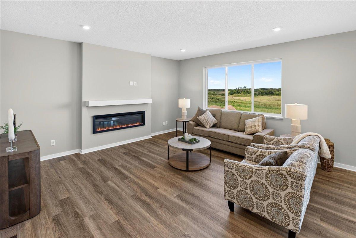 PHOTO OF A DIFFERENT HOME WITH SIMILAR PLAN & FINISHES.