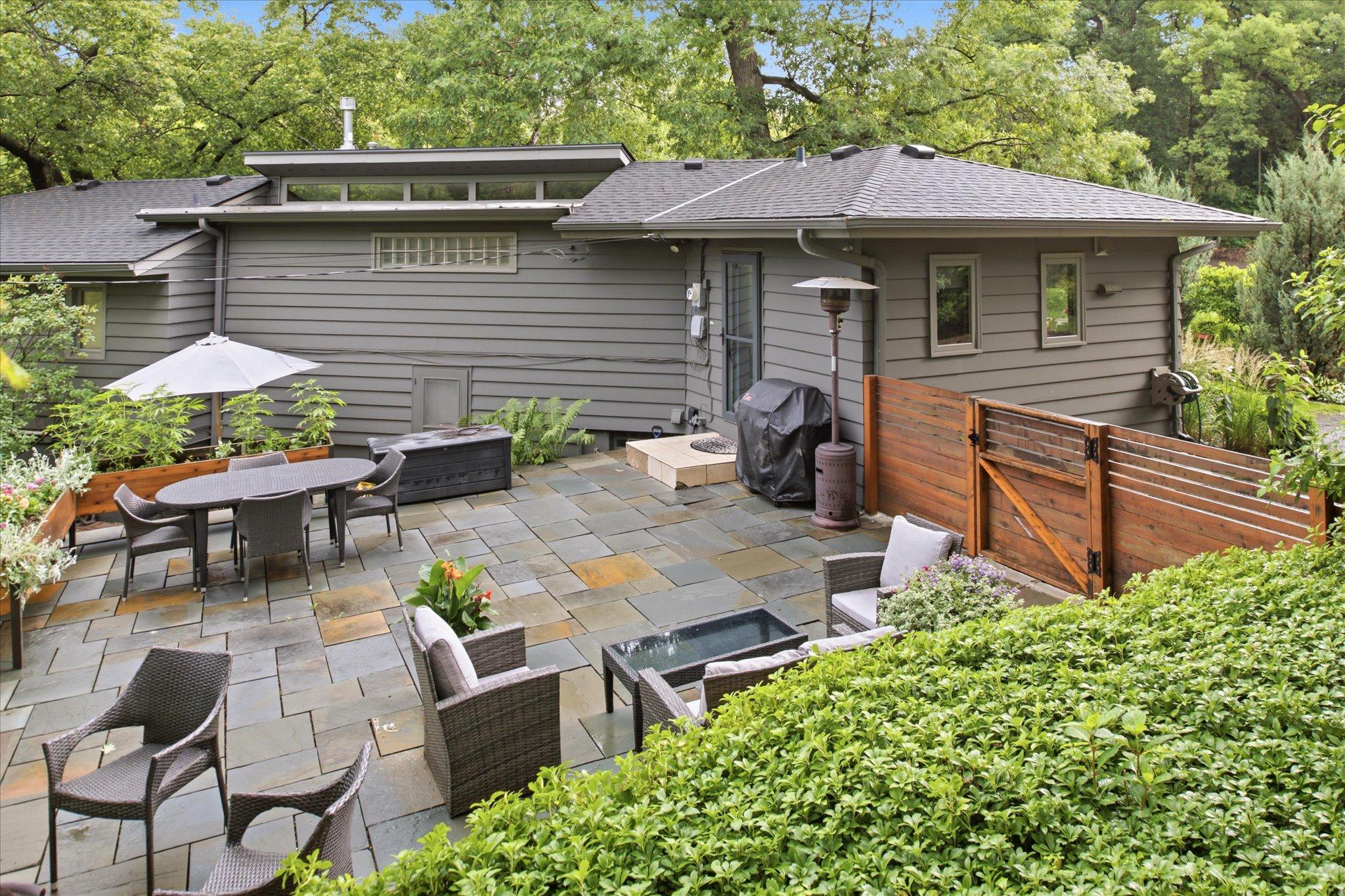 The kitchen steps out to a Blue Slate Patio and private back yard