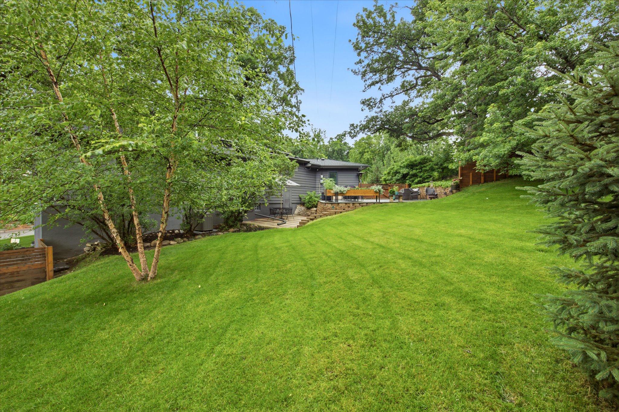Situated on a private .36 acre lot with beautiful mature trees