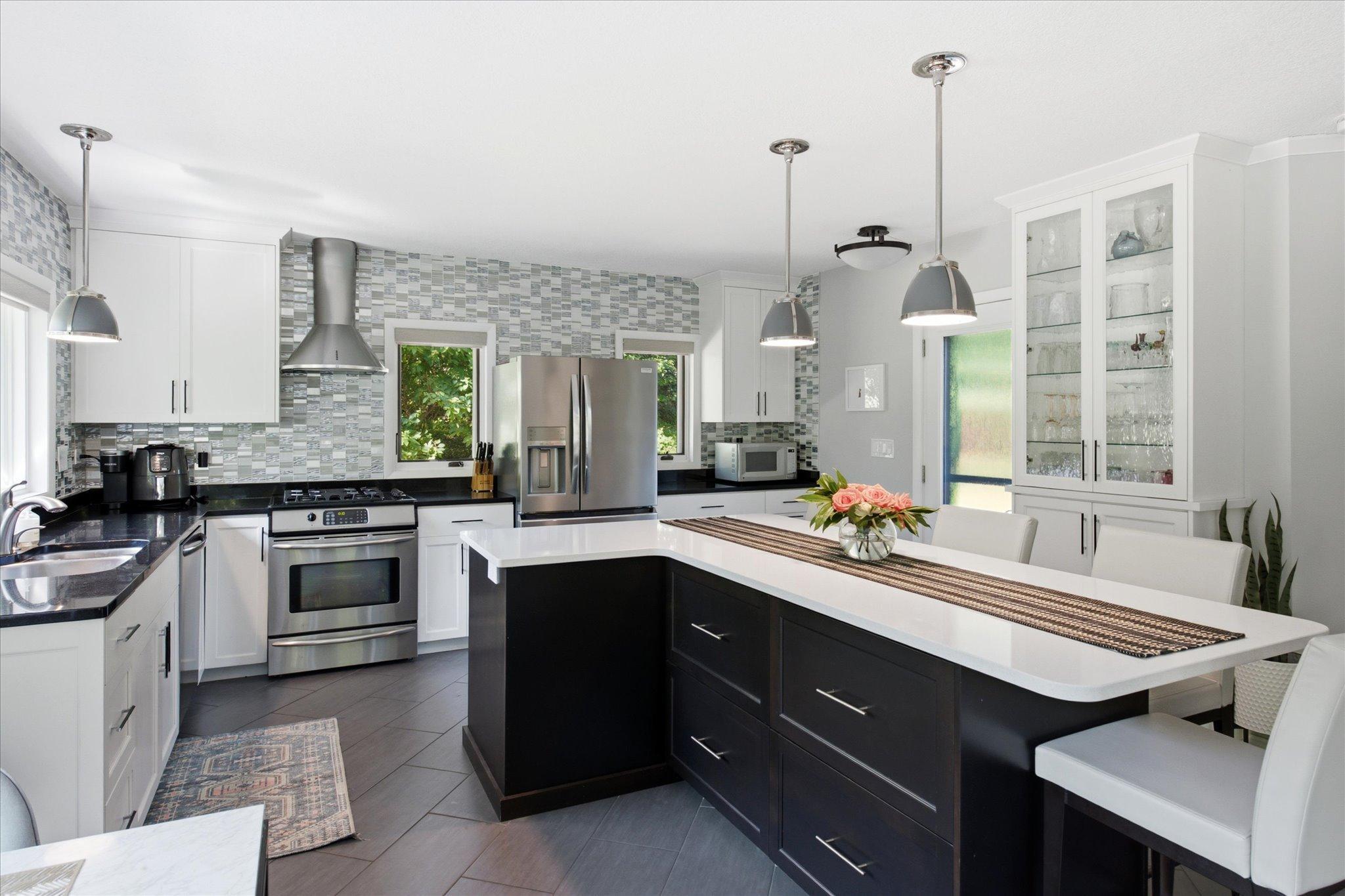 The Gourmet kitchen features top of the line stainless steel appliances, high-end cabinets and tiled floor