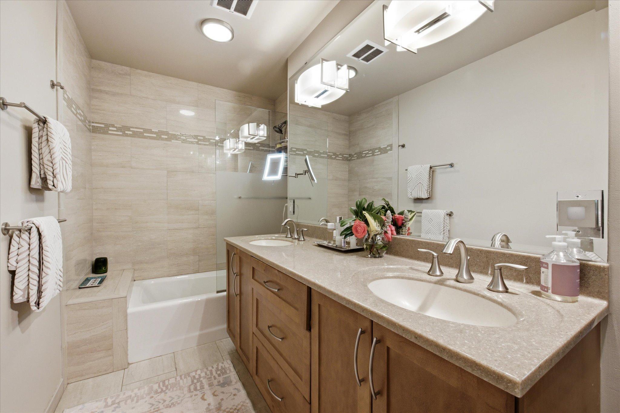 Upper level full tiled bath with double sinks