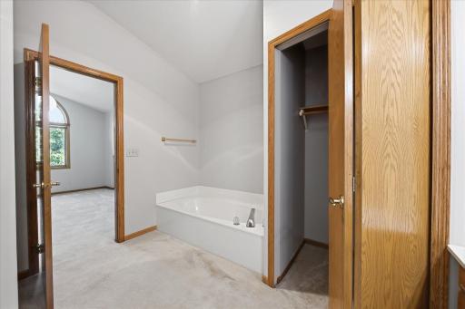 Soaking Tub and Linen Closet in the Walk Thru Bath