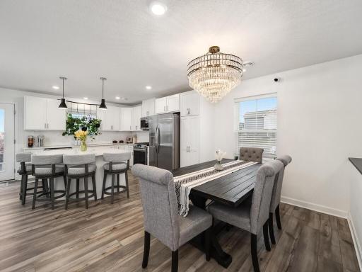 Beautiful Light Fixture, Formal Dining Area, Picture Window, LMV Flooring