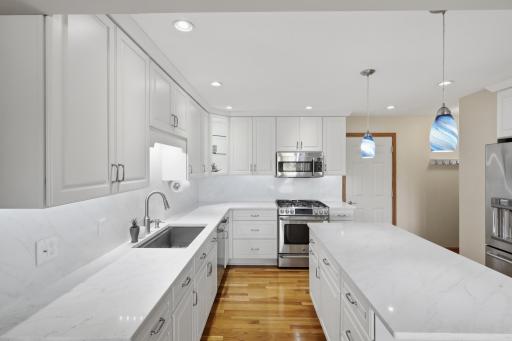 Spacious kitchen offering extensive custom cabinetry and ample workspace.