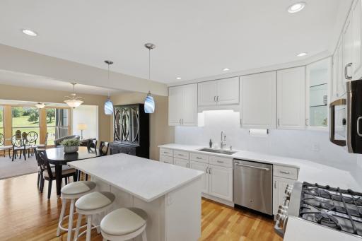 Seamless flow between living, dining, and kitchen areas.