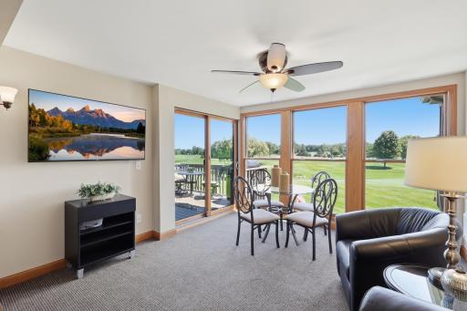 Relax in the sunroom while enjoying sweeping golf course views.