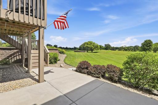 Ground level patio area provides another inviting outdoor retreat.