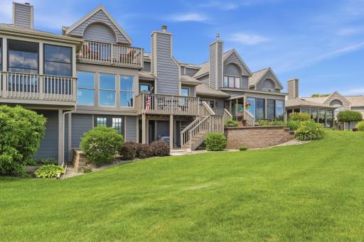 Beautifully landscaped backyard blends seamlessly with golf course surroundings