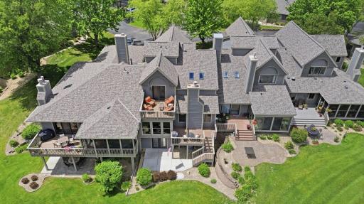 Rear exterior showcases multiple outdoor living spaces and exceptional views.