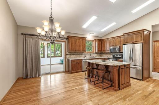 Open, Vaulted Kitchen Overlooking Acreage and Walking into the 4 Season Porch