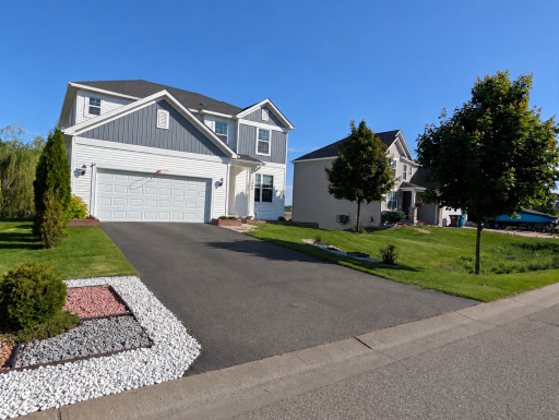 Striking curb appeal! This view showcases the modern architectural lines and the pristine, 100% chemical-free lawn