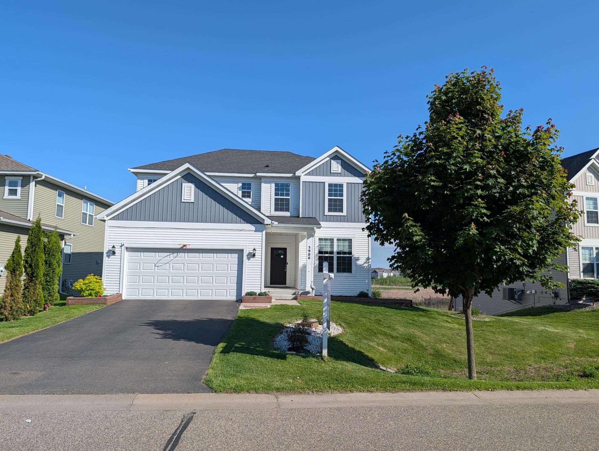 Striking curb appeal! This view showcases the modern architectural lines and the pristine, 100% chemical-free lawn