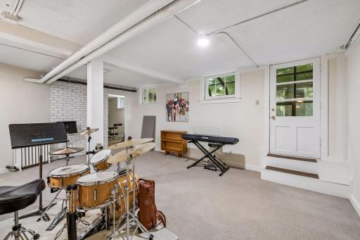 Finished lower level offers flexible space for recreation, fitness, hobbies, music, or media enjoyment.