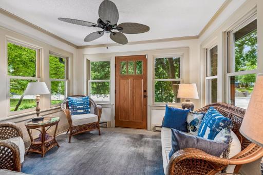 A sun-filled front porch provides the perfect spot for morning coffee, reading, or relaxing with friends.