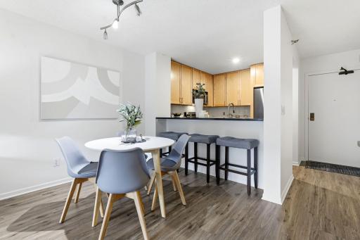 Open kitchen with breakfast-bar seating perfect for casual dining or entertaining.