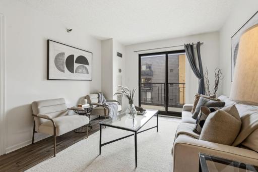 Bright living room with flexible space for relaxing, entertaining, or working from home.